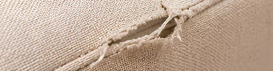 Loose or uneven stitching and puckered upholstery seams